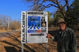 Toby Thompson, who met Paul McCartney, was invited to show Oklahoma County workers where to place the sign. Photo by Shellee Graham